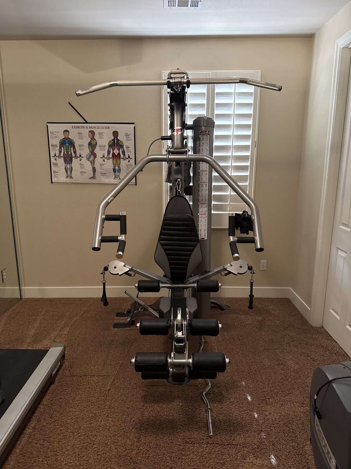 Home gym machine installed in a spare bedroom